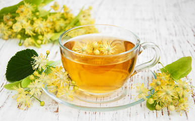 Cup of herbal tea with linden flowers