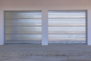 New Garage rolling metal doors installed into new building closeup detail