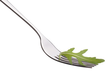 Fresh rucola  salad on fork isolated on white background cutout.