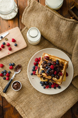 Waffles with fruits and chocolate