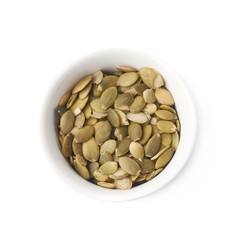 White cup filled with pumpkin seeds