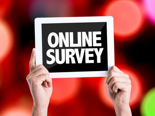 Tablet pc with text Online Survey with bokeh background