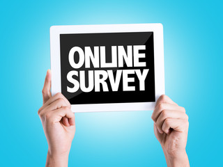 Tablet pc with text Online Survey with blue background