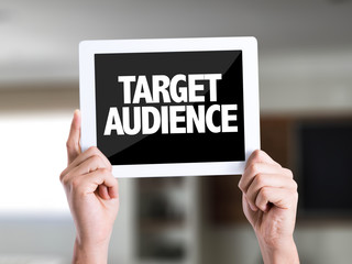 Tablet pc with text Target Audience on a house background
