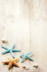 Summer setting with sea shells on old wooden background - 87742158