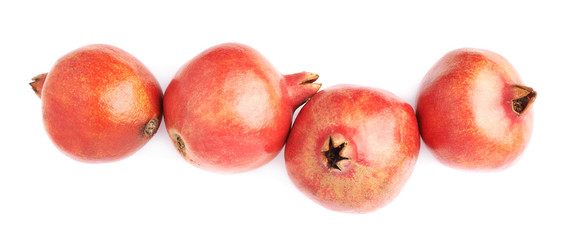 Four pomegranate fruits isolated