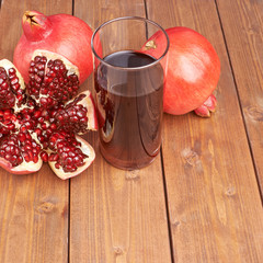 Pomegranate fruit next to the glass