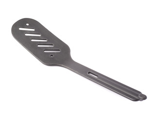 Used black plastic spatula isolated