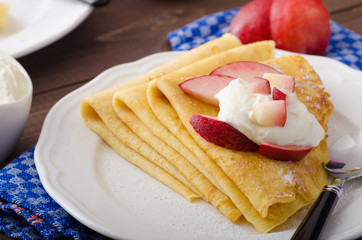 Cream pancakes with nectarines