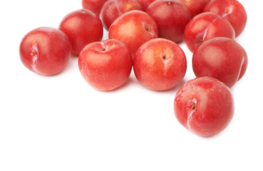 Fototapeta na wymiar Pile of multiple red plums isolated