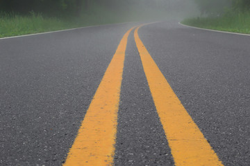 Double Yellow Lines on Road in the Fog