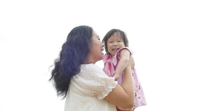 Asian mother and her child happy together outdoor,slow motion 