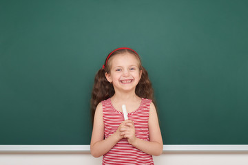 Schoolgirl write on school board