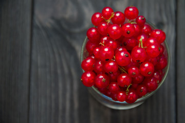 fresh sweet berry in a bowl on wooden background