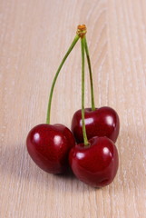 Fresh cherries on wooden table, healthy food