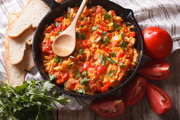 Turkish Menemen fried with vegetables close-up horizontal
