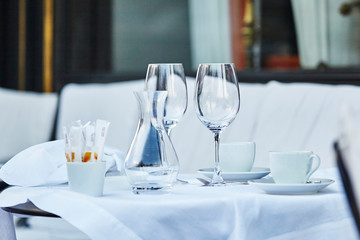 Empty wine glasses and coffee cup