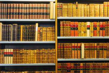 Old Vintage Books On Wooden Shelfs In Library