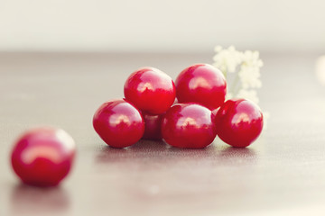 Red cherry and white flower