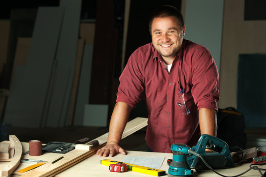 Portrait of happy professional carpenter.