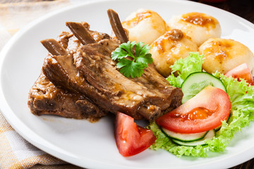 Pork spareribs served with silesian noodles and sauce