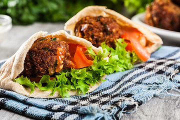 Pita bread with falafel and fresh vegetables