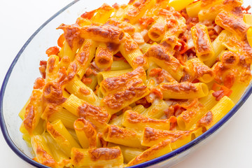 Baked macaroni cheese with tomatoes and sausage