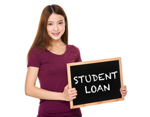 Young student hold with chalkboard showing phrase student loan