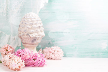 Background with fresh flowers hyacinths and decorative cone