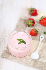 Fototapeta na wymiar Strawberry yogurt and ripe strawberry