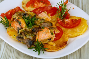 Roasted salmon with potato and tomato