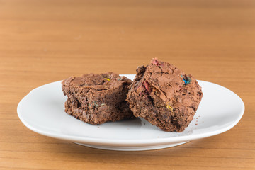 brownies in plate on wood table