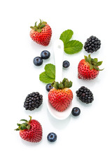 Fototapeta na wymiar fresh strawberry in white spoon, healthy, blackberry, mint, Blue