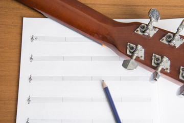 guitar notebook and pencil