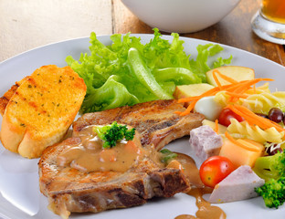 Pork chop steak with salad