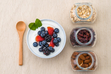 healthy breakfast with yogurt, berry and nuts, dieting