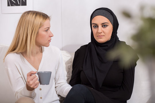 Scared woman and muslim friend