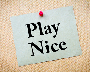 Play Nice Message written on paper note