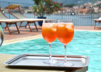 Traditional Italian Spritz cocktail against lake Como, Italy