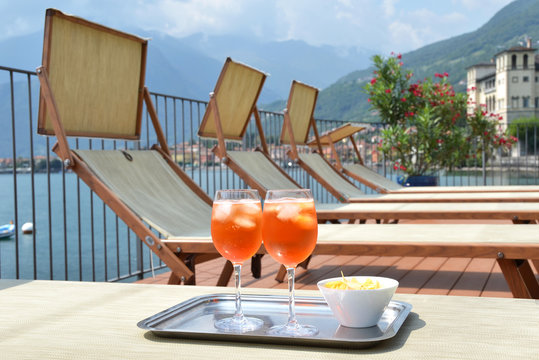 Traditional Italian Spritz Cocktail Against Lake Como, Italy