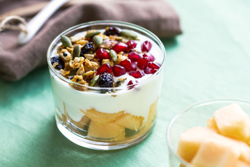 Granola with Greek yogurt and Cantaloupe