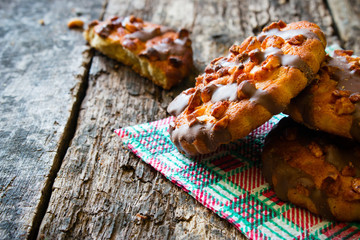 delicious cookies with chocolate and nuts on a napkin closeup