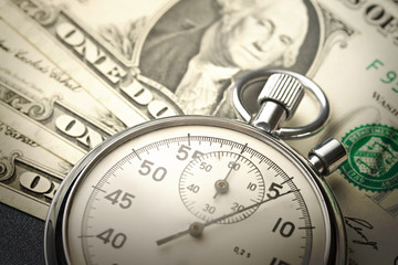 Stopwatch and dollars