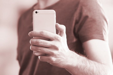 Man using smart phone close-up