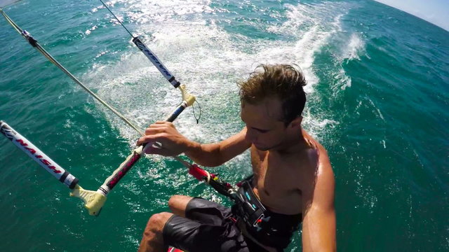 Extreme POV Shot of Young Man Catching Air Kitesurfing in Slow Motion HD.