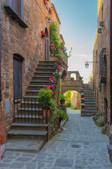 Fototapeta na wymiar Stairs to the houses in old italian town