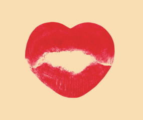 Kissing lips in shape of heart on beige background