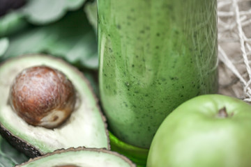 Green smoothie with fresh fruit  and vegetables.