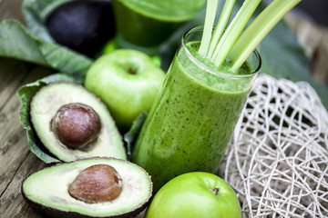 Green smoothie with fresh fruit  and vegetables.