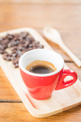 Fresh brewed hot espresso with roasted bean
